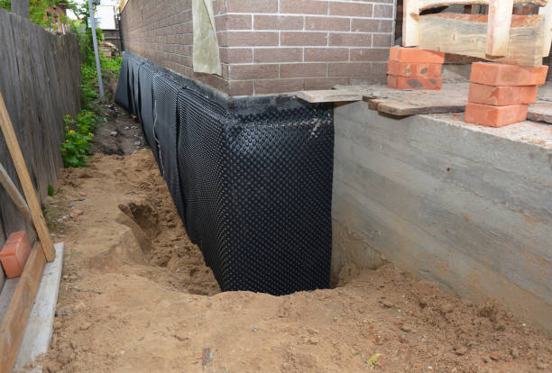 Happy homeowners after waterproofing job in Hilham